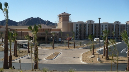 Quechan Casino and Hotel exterior view showcasing palm trees and the surrounding landscape.